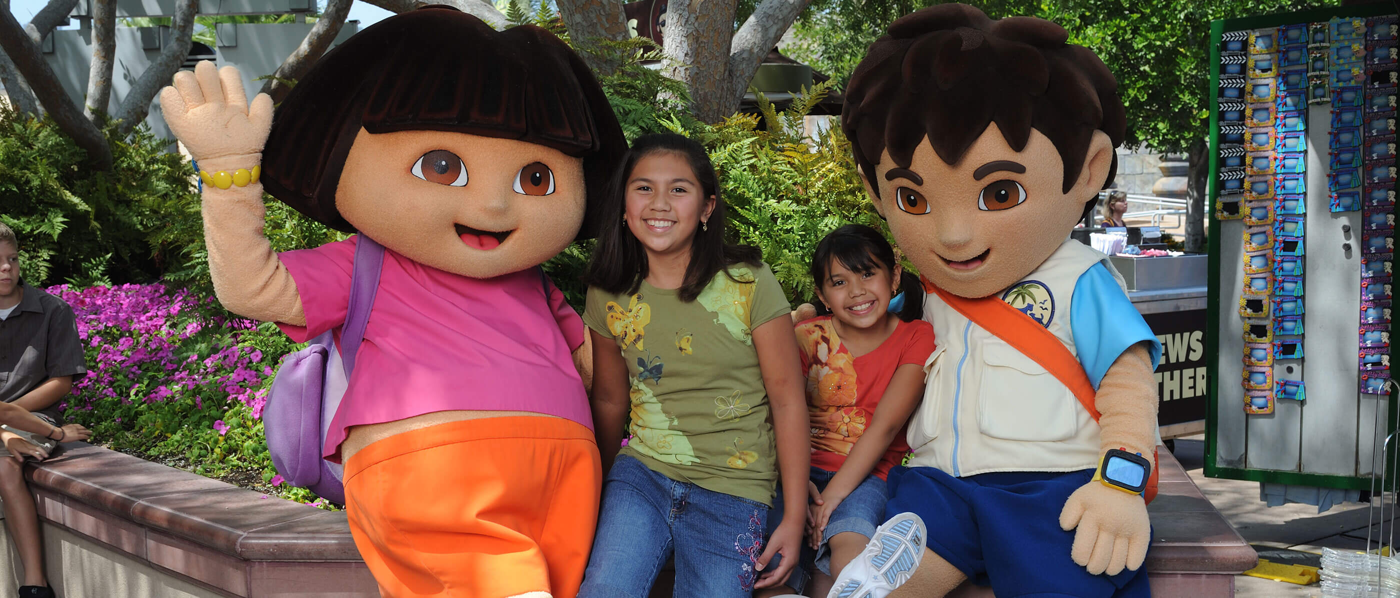 Two Dora characters with two children.