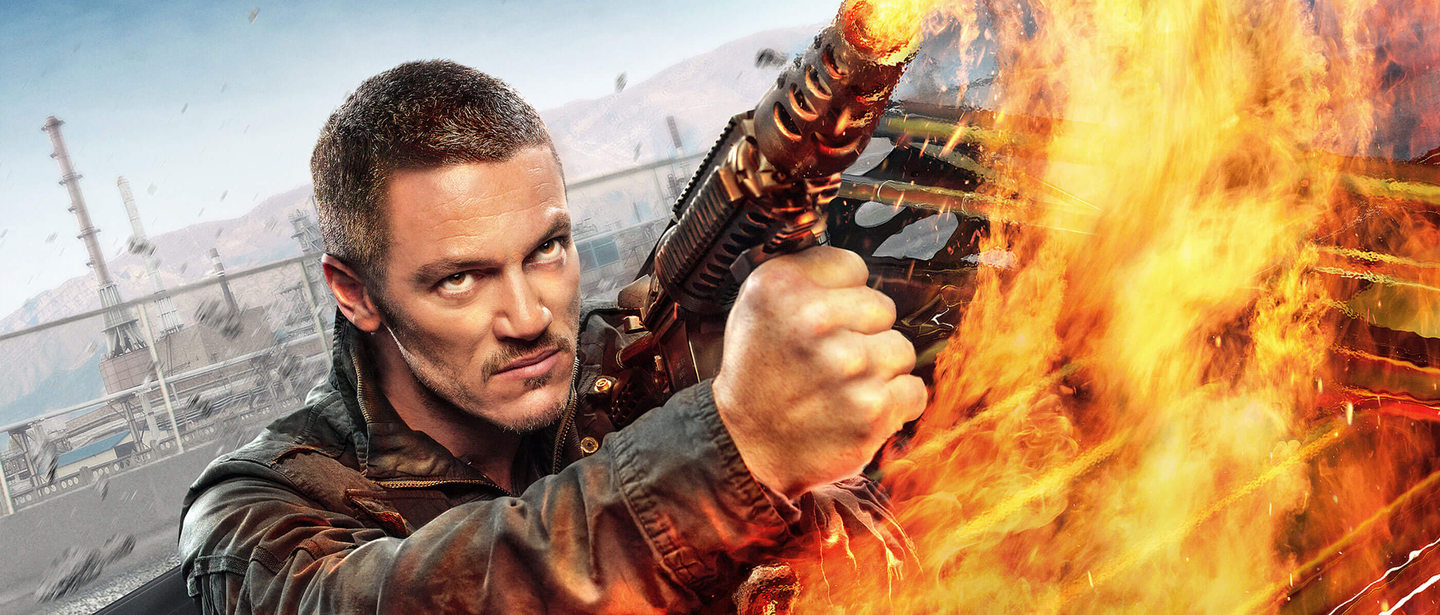 A man in a leather jacket uses a flamethrower.