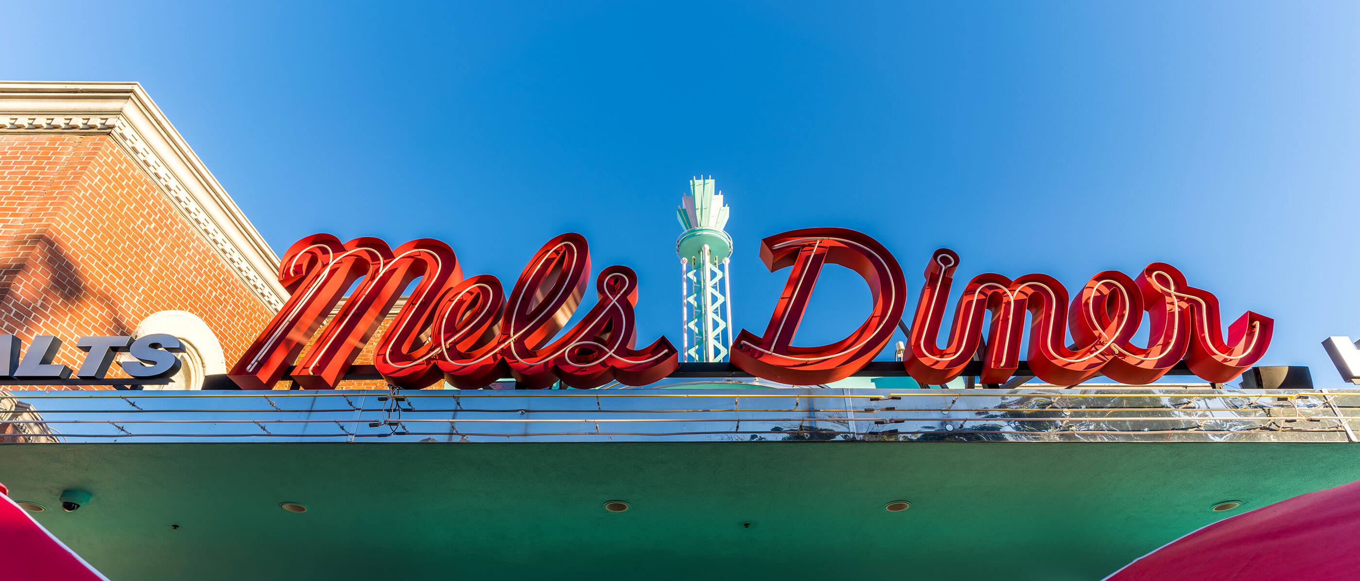 Mel's Diner sign on a sunny day.