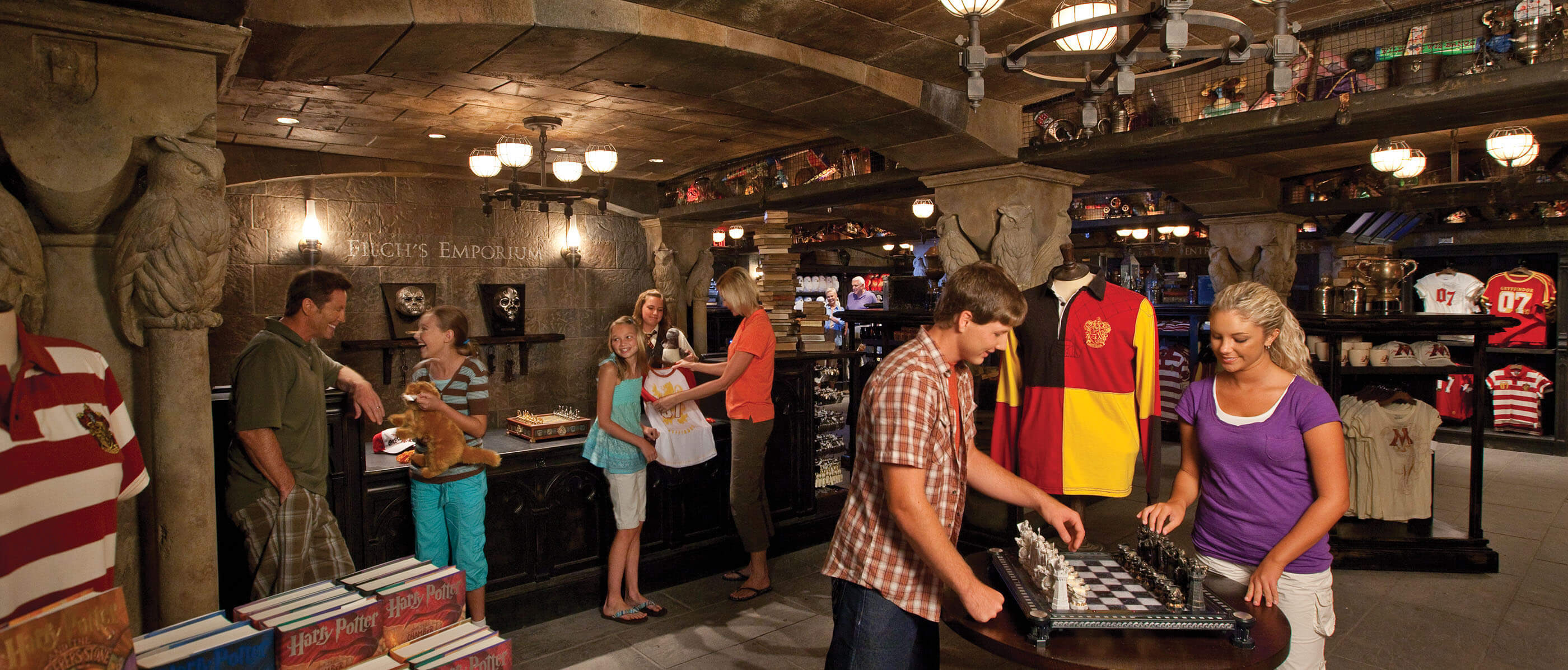People shopping at Filch's Emporium gift shop.