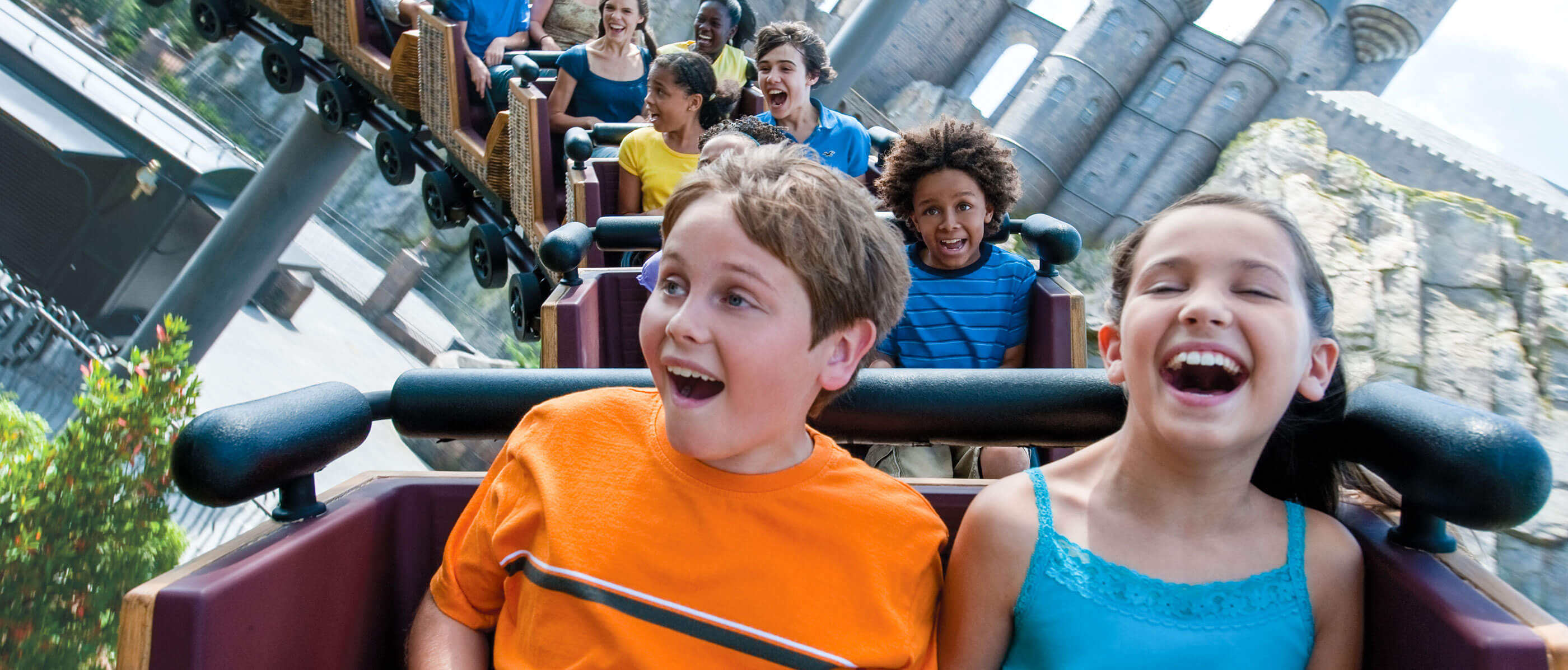 Children on the Flight of the Hippogriff ride at The Wizarding World of Harry Potter.