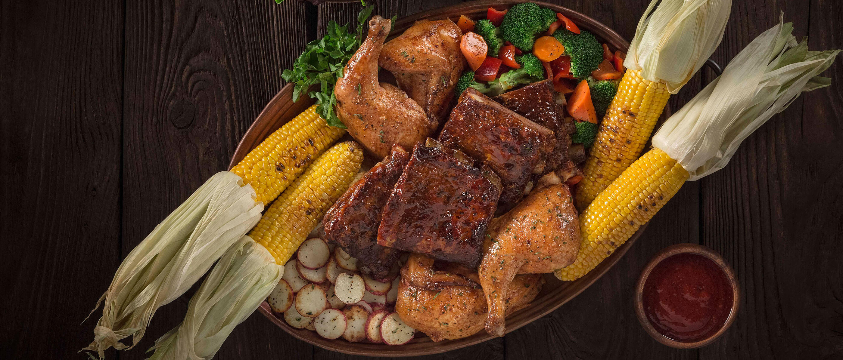 Three Broomsticks big meal with corn, meals, and vegetables.