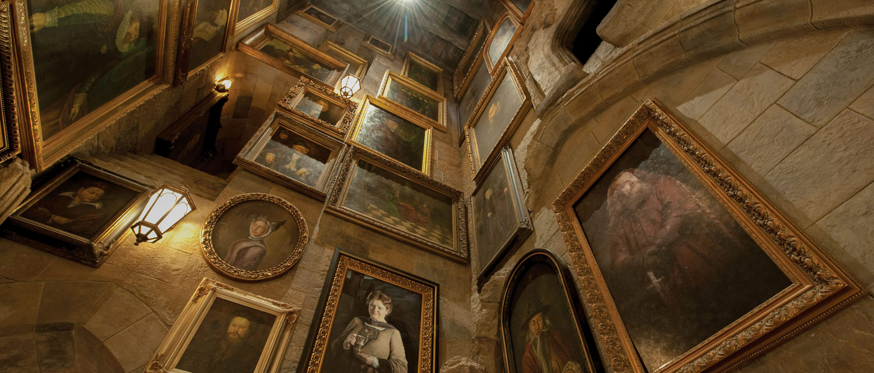 Walls with multiple portraits on them.