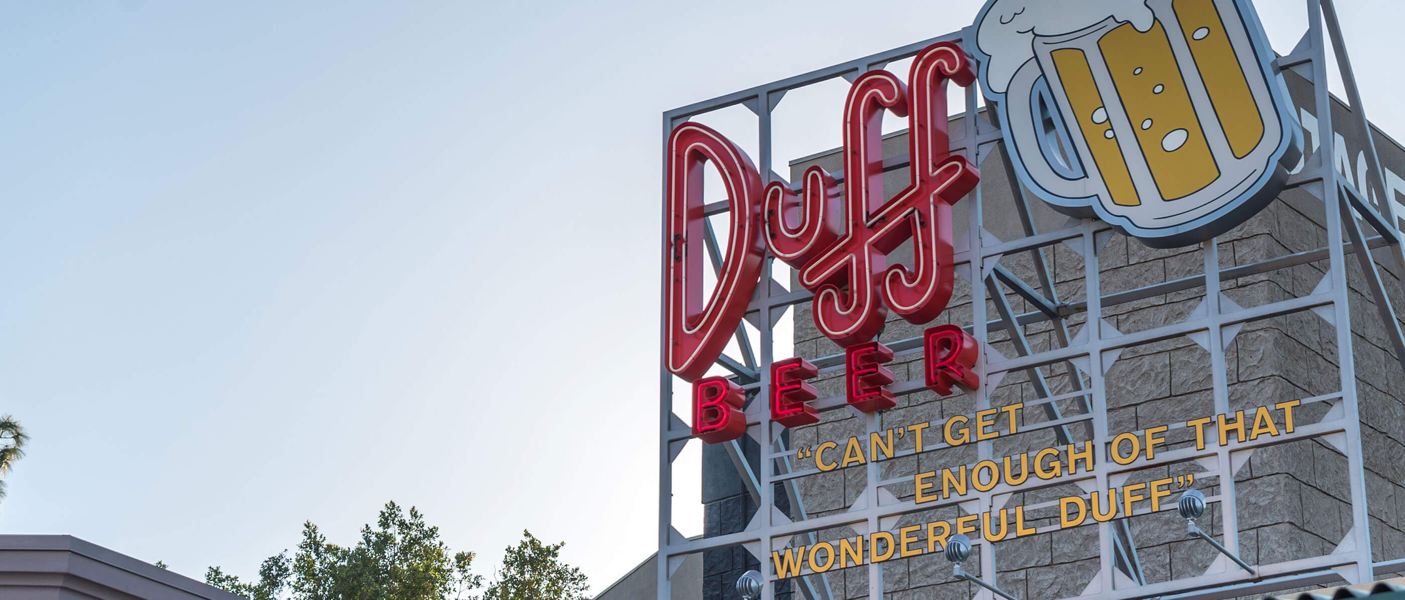 Duff Beer sign with a mug of beer beside it and the quote