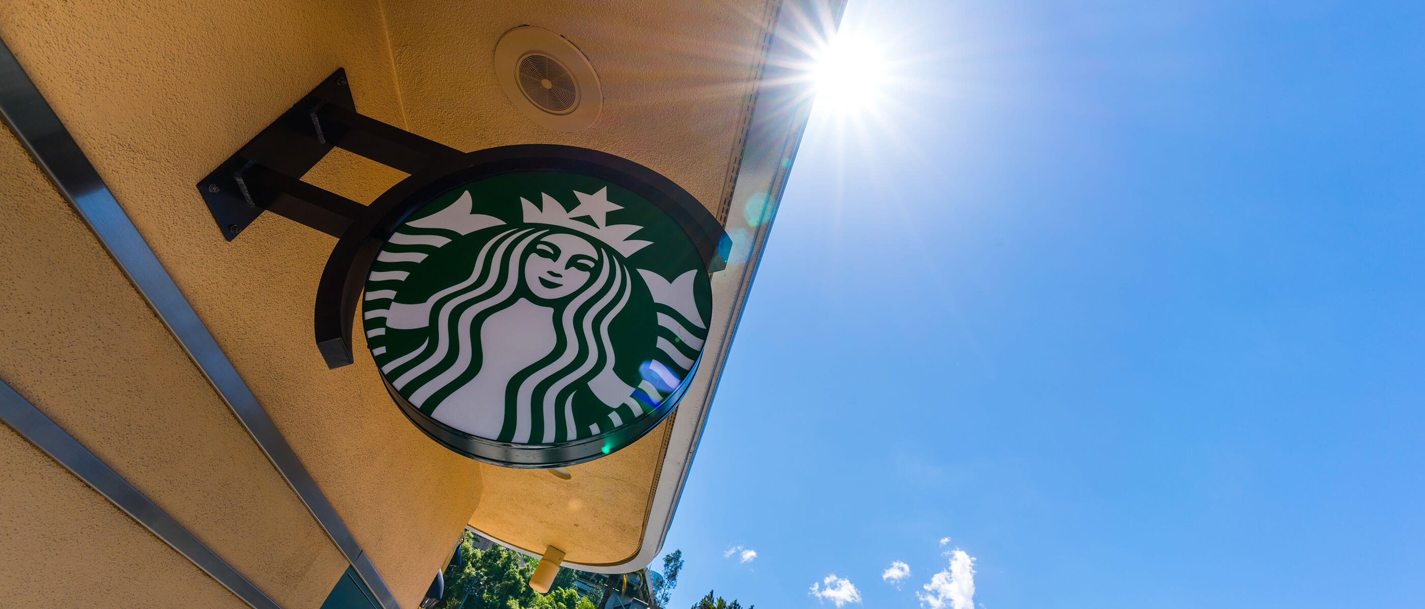 Starbucks sign on a sunny day.