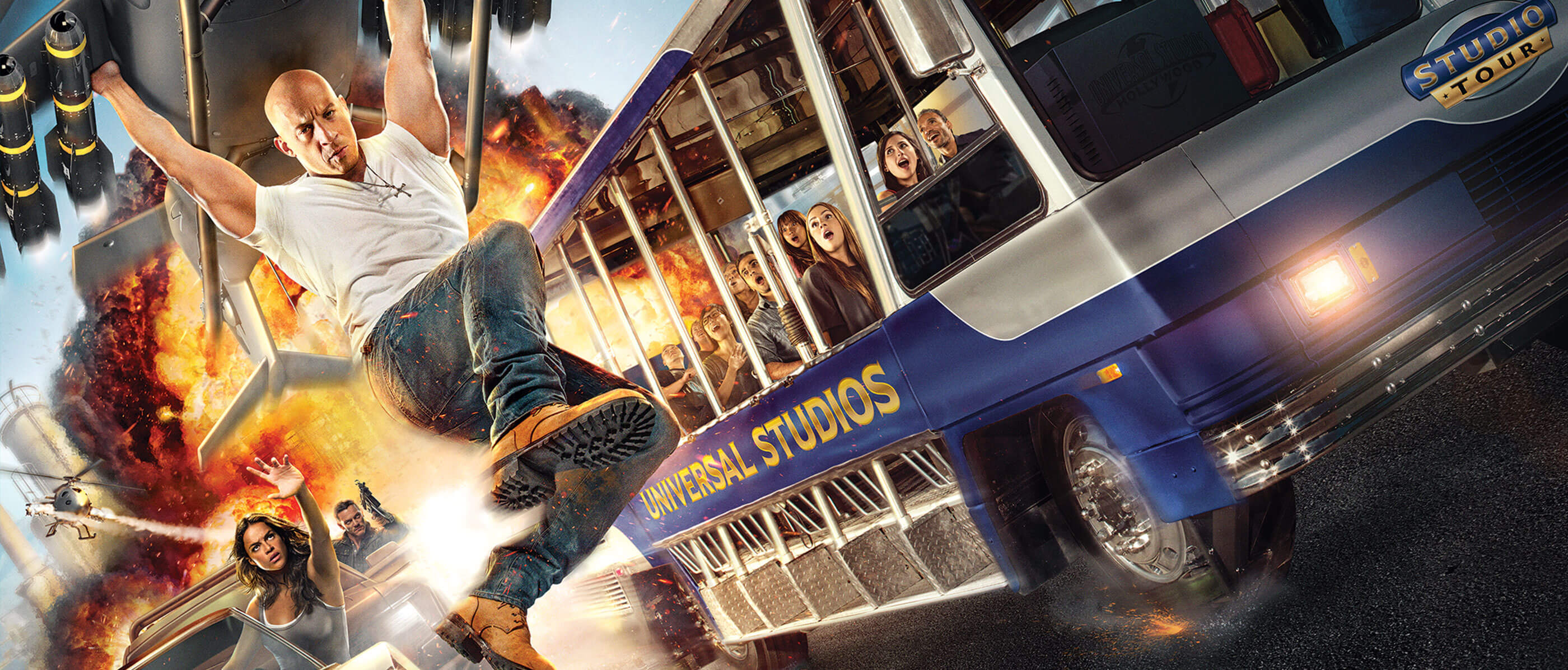 A Fast and the Furious poster with Vin Diesel holding onto a plan and a Universal Studio tour bus beside it.