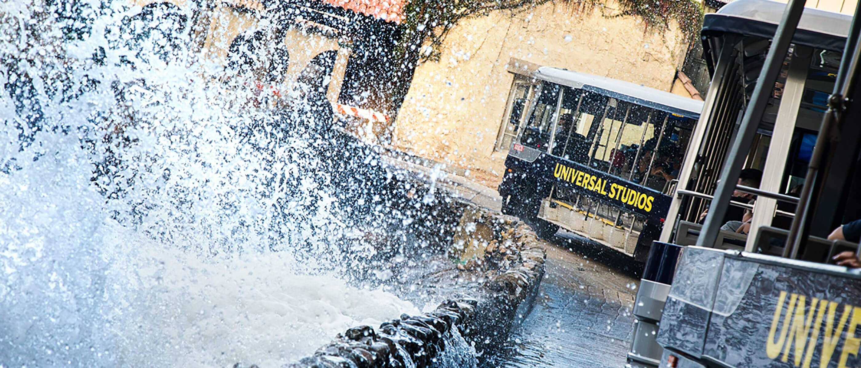 Big splash and two Universal Studios trolleys passing by.