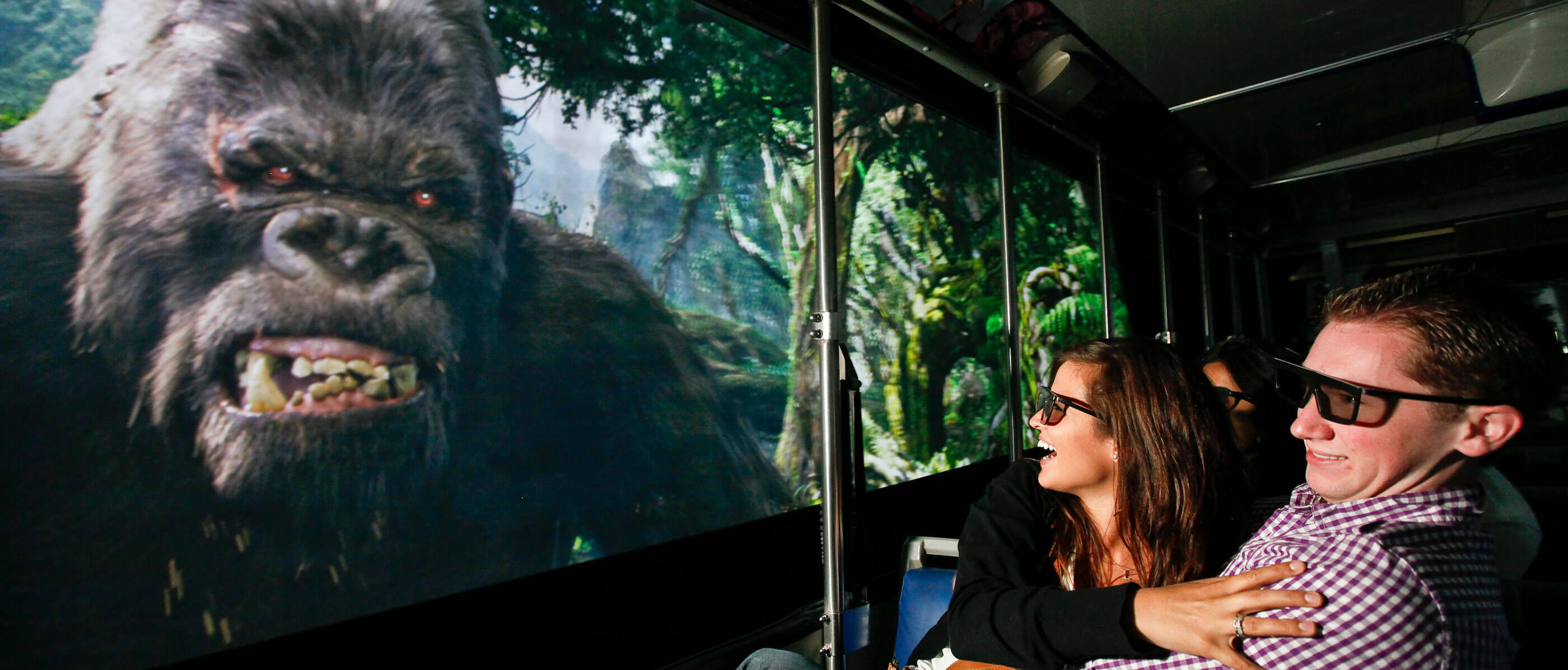 Two people watching a King Kong close up.