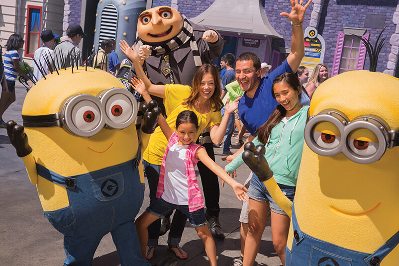 Two minions, Gru and a family.