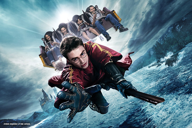 Four kids on the Harry Potter Forbidden Journey ride with Harry Potter flying on a broom.