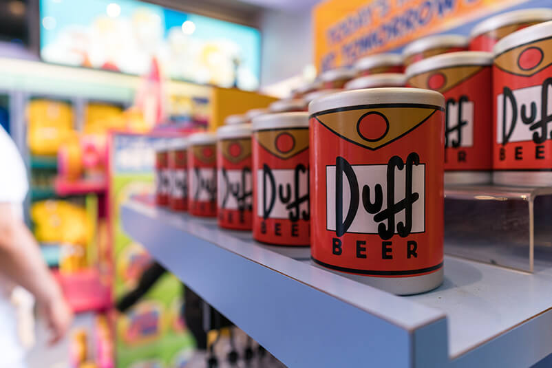 Mugs with Duff Beer on them.