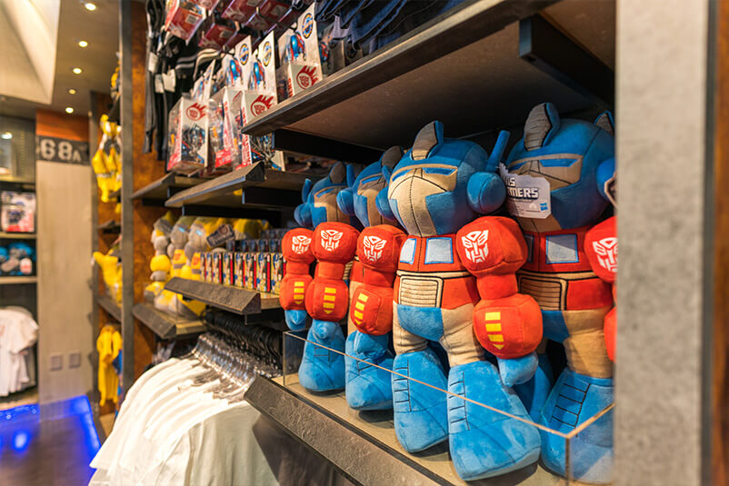 Shelves full of Transformers merchandise.