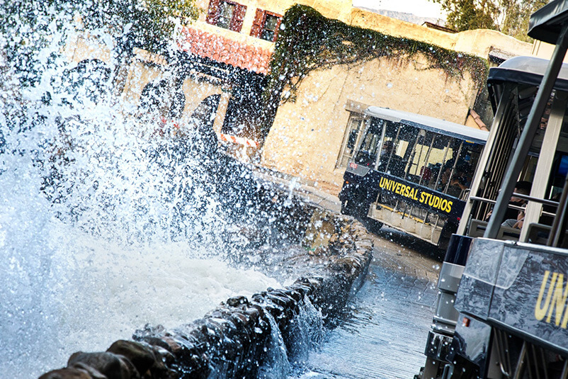 A big splash and two Universal Studios trolleys passing by.