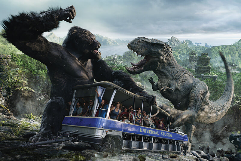 A studio tour of the King Kong set with King Kong fighting in the background.