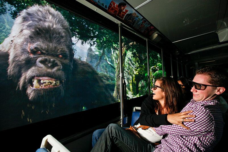 Two people watching a King Kong close up.