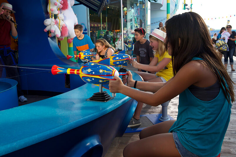 Teenagers playing games at Super Silly Fun Land Carnival.