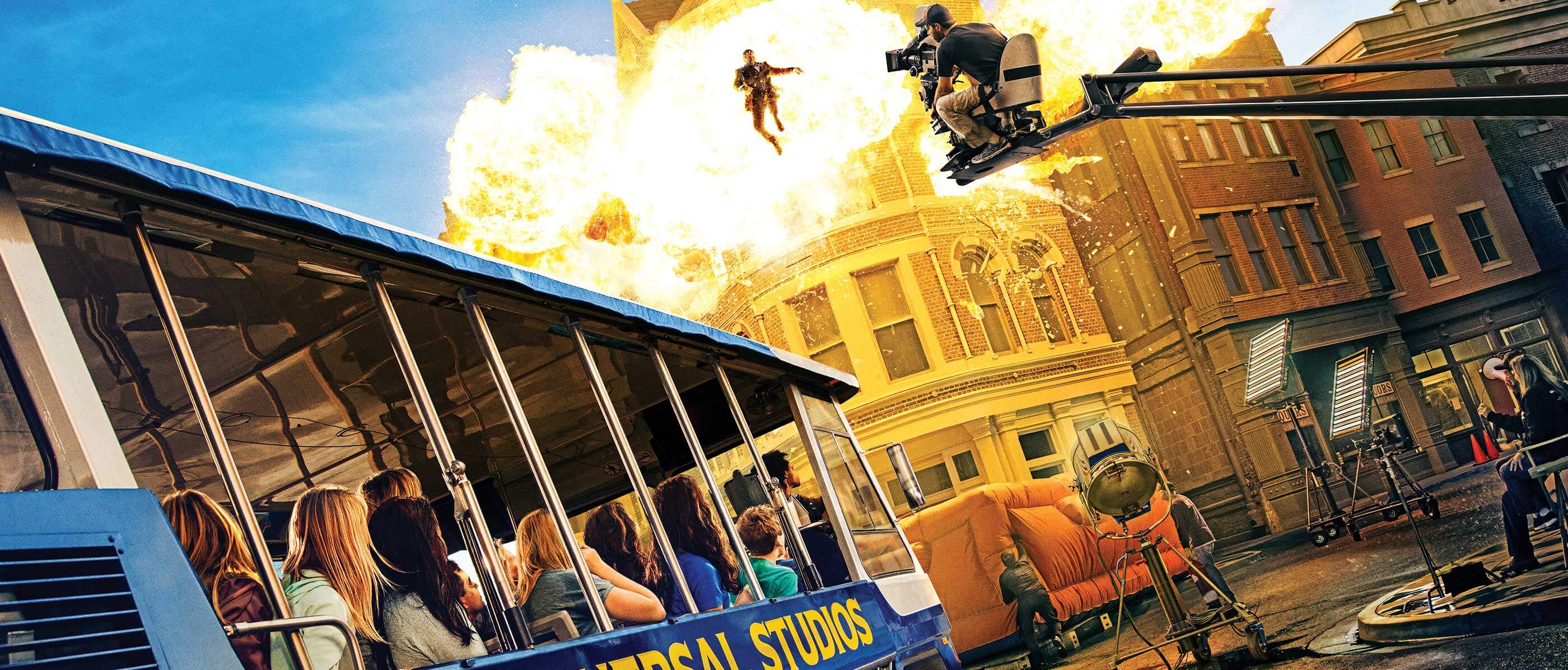 The Universal Studios tram travels past an explosive special effects scene.