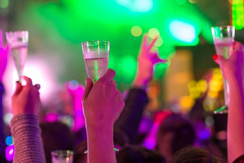 EVE people raising glasses