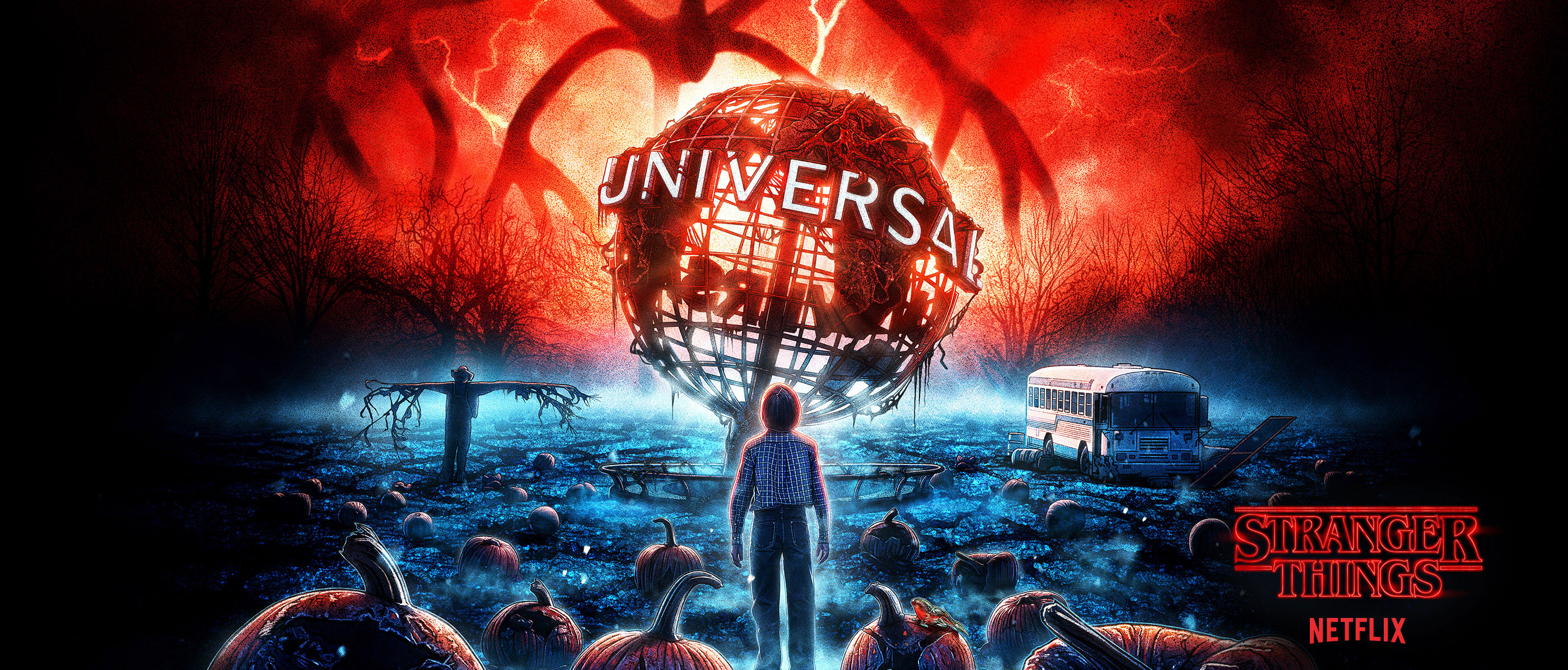 Will Byers in front of the Universal Globe surrounded by pumpkins