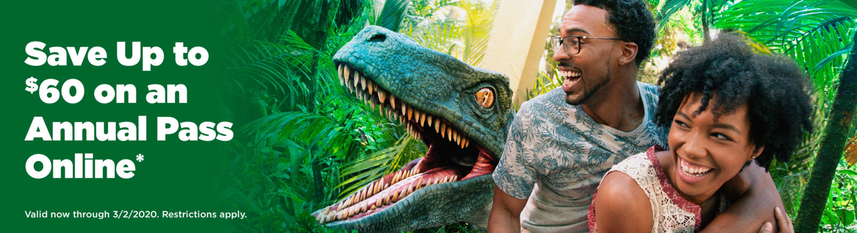 Couple with Raptor in the background - Save up to $60 on an Annual Pass Online*